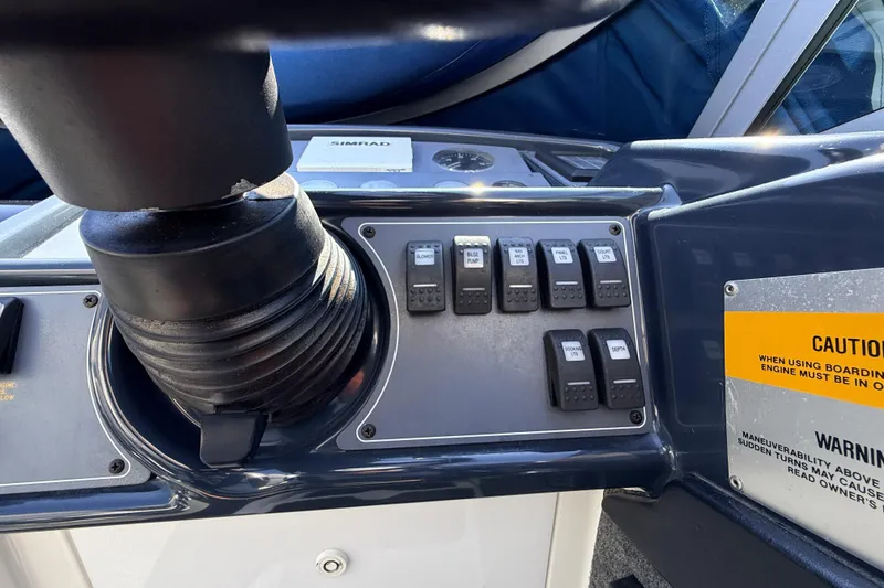 Slide: The Image of Control panel of a 1995 Formula 303 SR-1 boat with switches and caution label. - 18