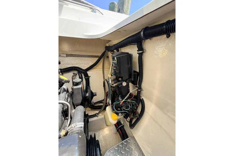 Slide: The Image of Engine compartment of a 1995 Formula 303 SR-1 boat, showcasing wiring and components. - 40