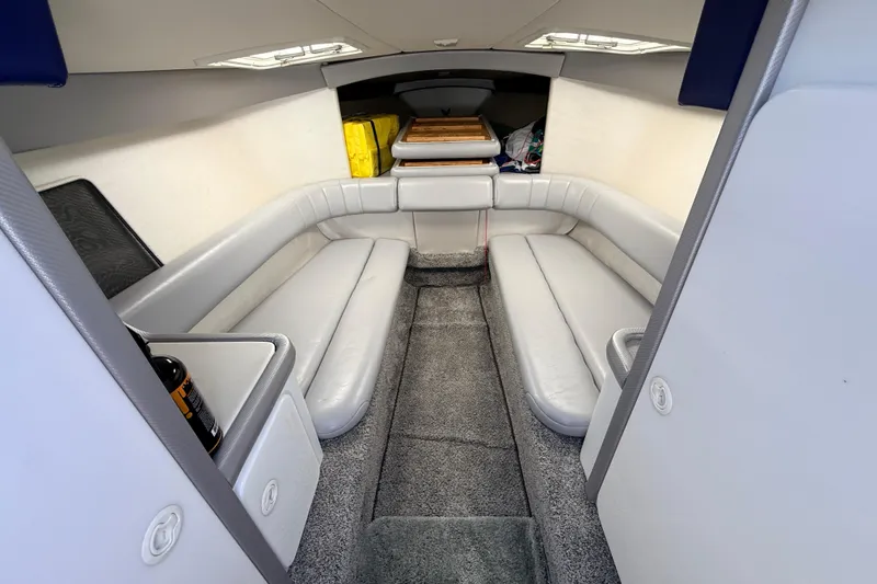 Slide: The Image of Interior of a 1995 Formula 303 SR-1 boat with gray seating and carpet. - 28