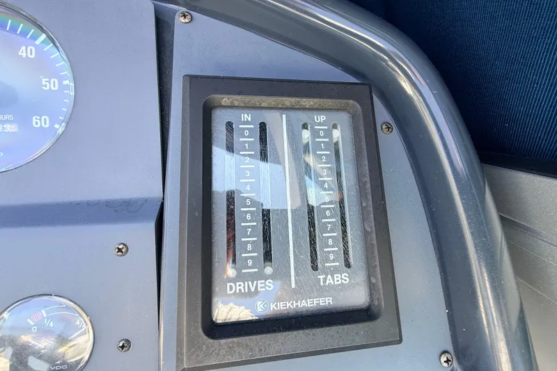 Slide: The Image of Control panel of a 1995 Formula 303 SR-1 boat with Kiekhaefer drives and tabs. - 17