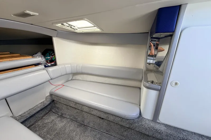 Slide: The Image of Interior of a 1995 Formula 303 SR-1 boat with gray seating and carpet. - 31