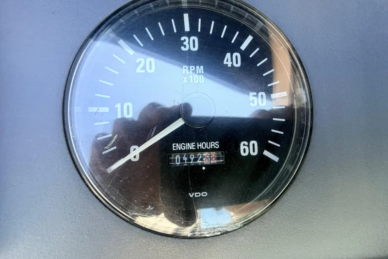 Slide: The Image of Tachometer of 1995 Formula 303 SR-1 showing RPM and engine hours. - 13