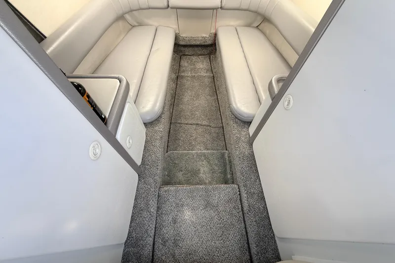 Slide: The Image of Interior of a 1995 Formula 303 SR-1 boat with gray seating and carpet. - 27