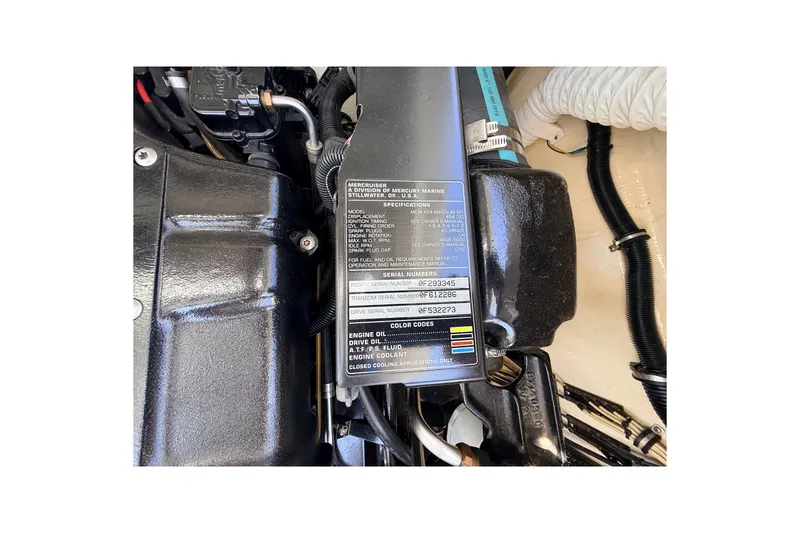 Slide: The Image of Engine compartment of a 1995 Formula 303 SR-1 boat, featuring detailed specifications. - 44