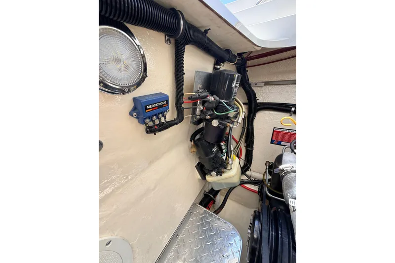 Slide: The Image of Engine compartment of a 1995 Formula 303 SR-1 boat, featuring wiring and components. - 39