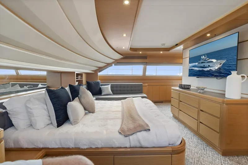 Slide: The Image of Luxurious bedroom interior of 2011 Ferretti Yachts 97 with modern decor and large windows. - 27