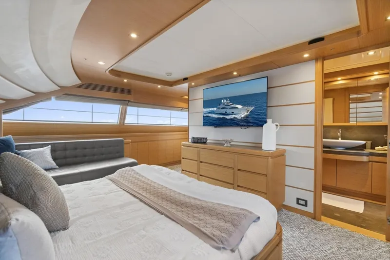 Slide: The Image of Luxurious Ferretti Yachts 97 interior, featuring elegant bedroom and modern amenities, 2011 model. - 29