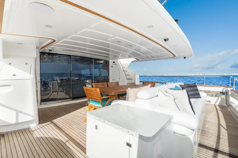 Slide: The Image of Luxurious 2011 Ferretti Yachts 97 deck with elegant seating and ocean view. - 60