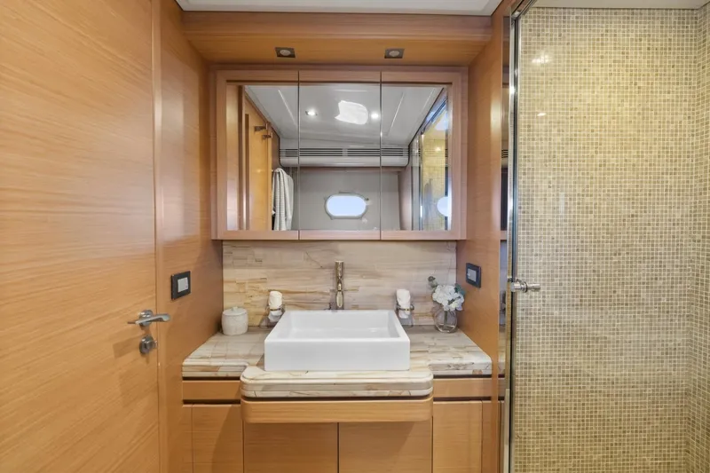 Slide: The Image of Luxurious bathroom interior of 2011 Ferretti Yachts 97, featuring elegant wood finishes and modern fixtures. - 38