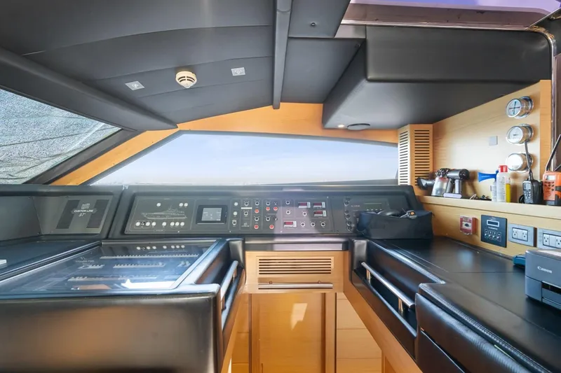 Slide: The Image of Cockpit of 2011 Ferretti Yachts 97, featuring modern navigation controls and sleek design. - 19