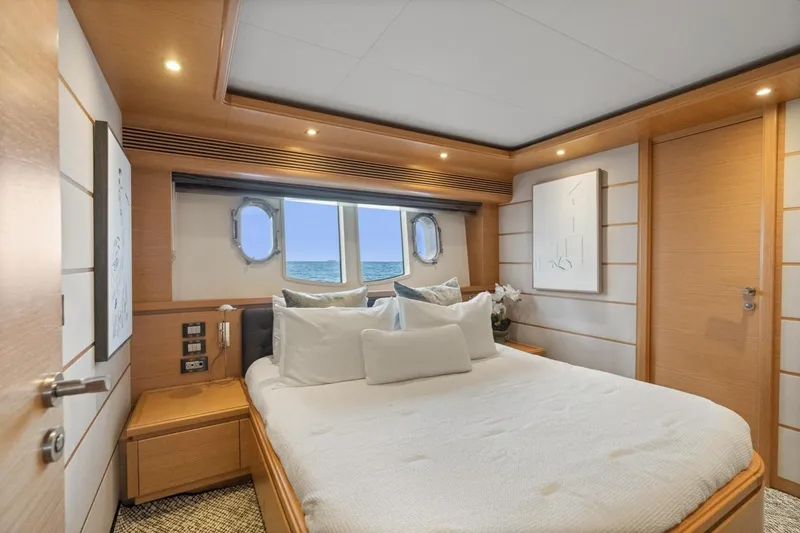 Slide: The Image of Luxurious bedroom interior of 2011 Ferretti Yachts 97 with ocean view through porthole. - 33
