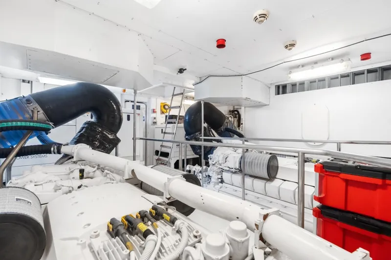 Slide: The Image of Engine room of a 2011 Ferretti Yachts 97, showcasing machinery and equipment. - 65