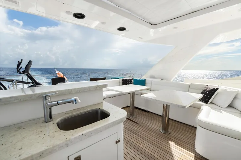 Slide: The Image of Luxurious 2011 Ferretti Yachts 97 deck with seating, ocean view, and modern amenities. - 51