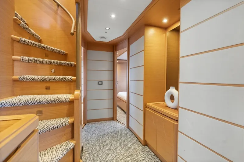 Slide: The Image of Luxurious interior of 2011 Ferretti Yachts 97, featuring elegant wood paneling and modern design. - 31
