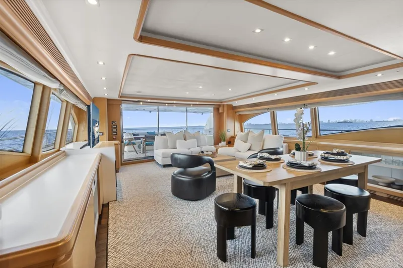 Slide: The Image of Luxurious interior of 2011 Ferretti Yachts 97 with elegant dining and seating area. - 16