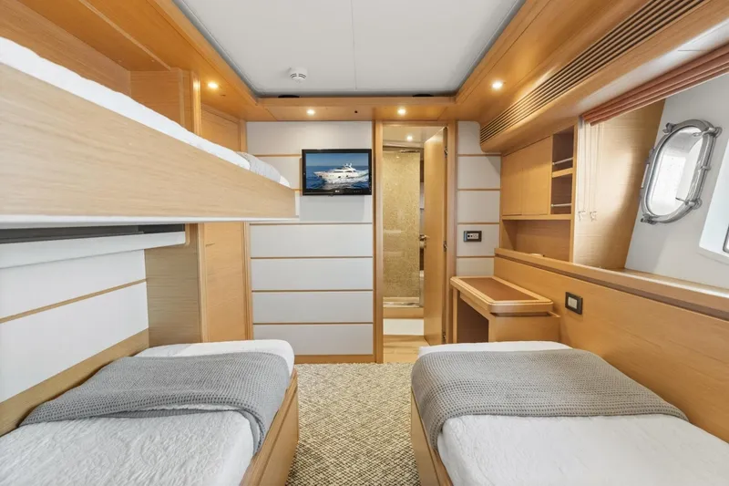 Slide: The Image of Luxurious cabin interior of 2011 Ferretti Yachts 97, featuring twin beds and modern design. - 36