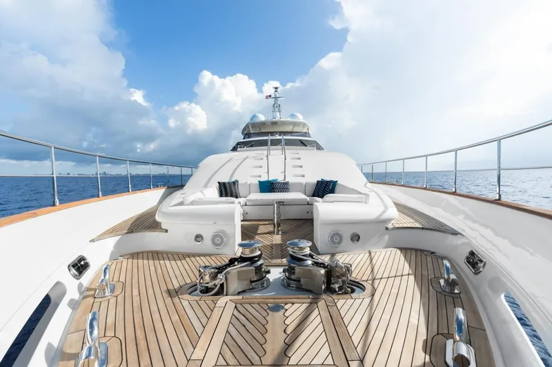 Slide: The Image of Luxurious 2011 Ferretti Yachts 97 on open sea, featuring elegant deck and seating area. - 53