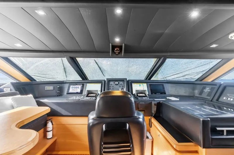 Slide: The Image of Luxurious helm of 2011 Ferretti Yachts 97, featuring advanced navigation systems and sleek design. - 17