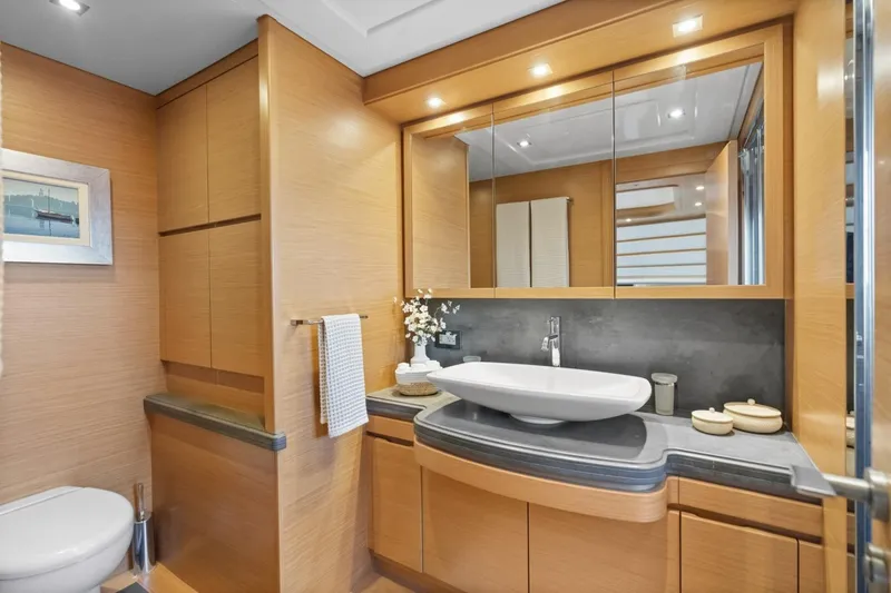 Slide: The Image of Luxurious bathroom in 2011 Ferretti Yachts 97, featuring modern fixtures and elegant wood cabinetry. - 41