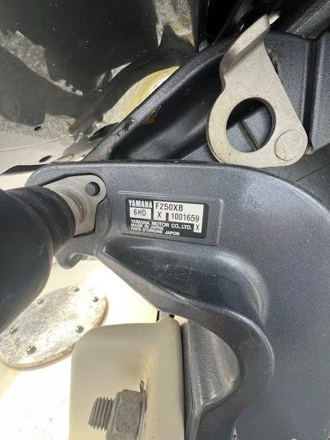 Slide: The Image of Close-up of a Yamaha F250XB outboard motor on a 2003 Grady-White 225 Express boat. - 10