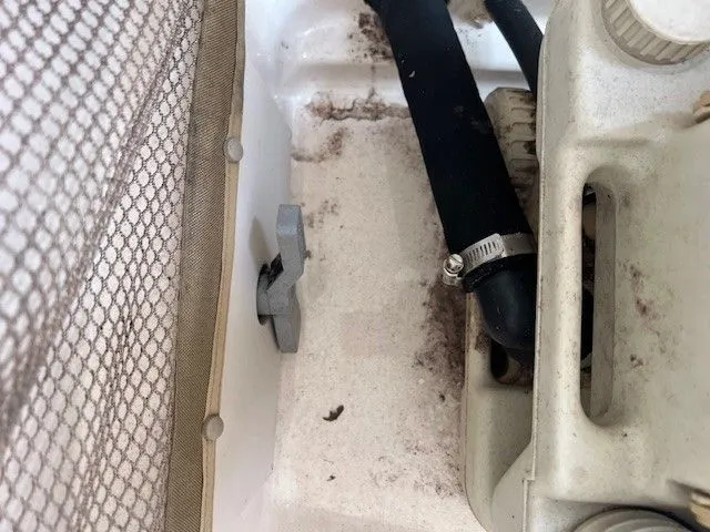 Slide: The Image of Close-up of a boat part with hoses and netting. - 23