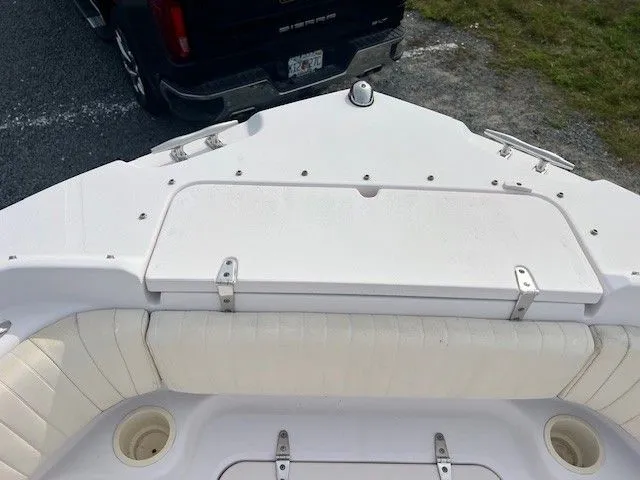 Slide: The Image of The image shows the bow deck of a 2003 Grady-White 225 Express boat with seating area. - 20