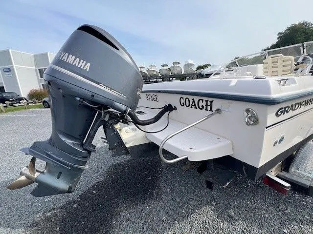 Slide: The Image of A 2003 Grady-White 225 Express boat with a Yamaha outboard motor. - 4