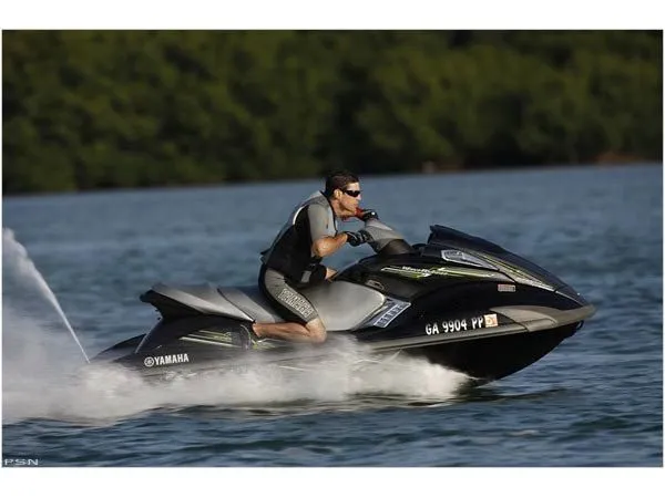 Slide: The Image of A man rides a black Yamaha FX® SHO jet ski on the water. - 3