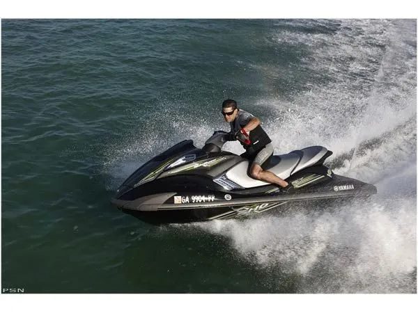 Slide: The Image of A man rides a 2009 Yamaha FX® SHO jet ski on the water. - 5