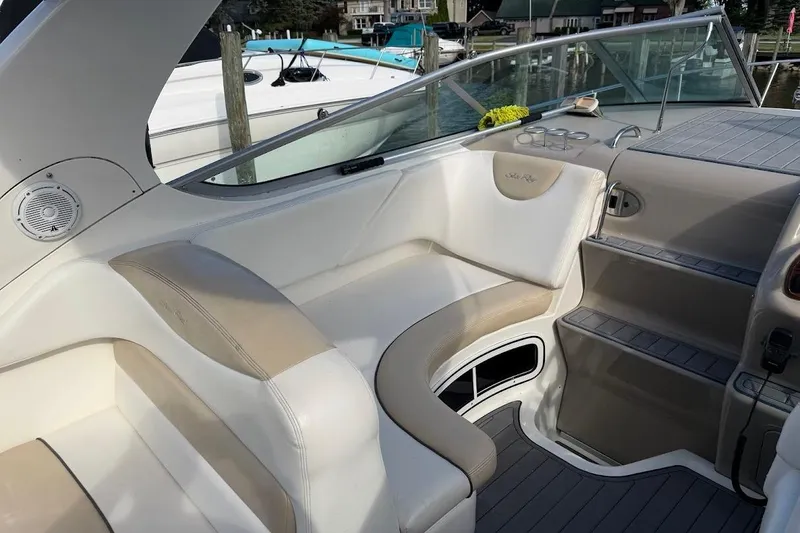 Slide: The Image of 2008 Sea Ray Sundancer 280 interior with beige seating and sleek design. - 11