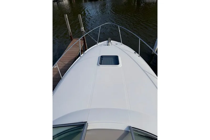 Slide: The Image of 2008 Sea Ray Sundancer 280 boat deck, docked by calm waters. - 7