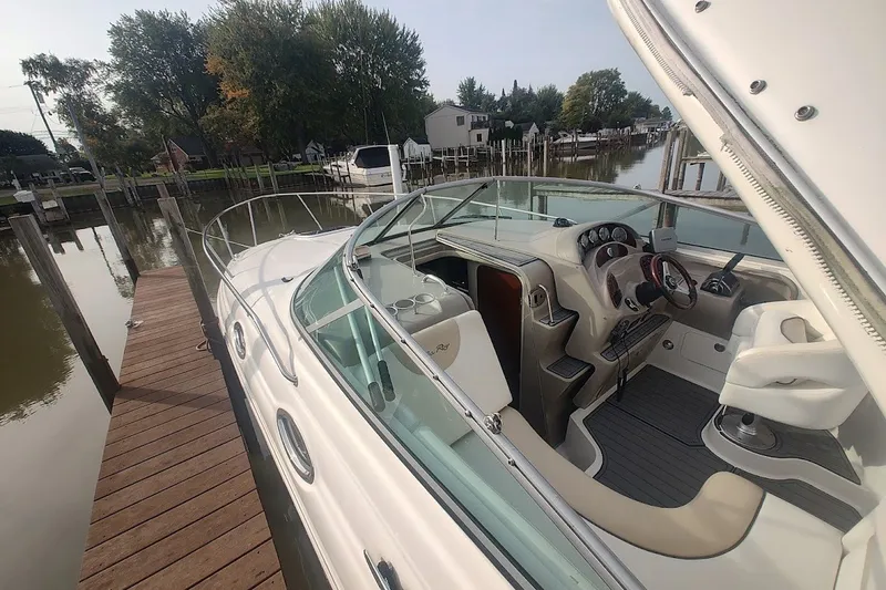Slide: The Image of 2009 Sea Ray Sundancer 280 docked, showcasing sleek design and luxurious interior. - 17