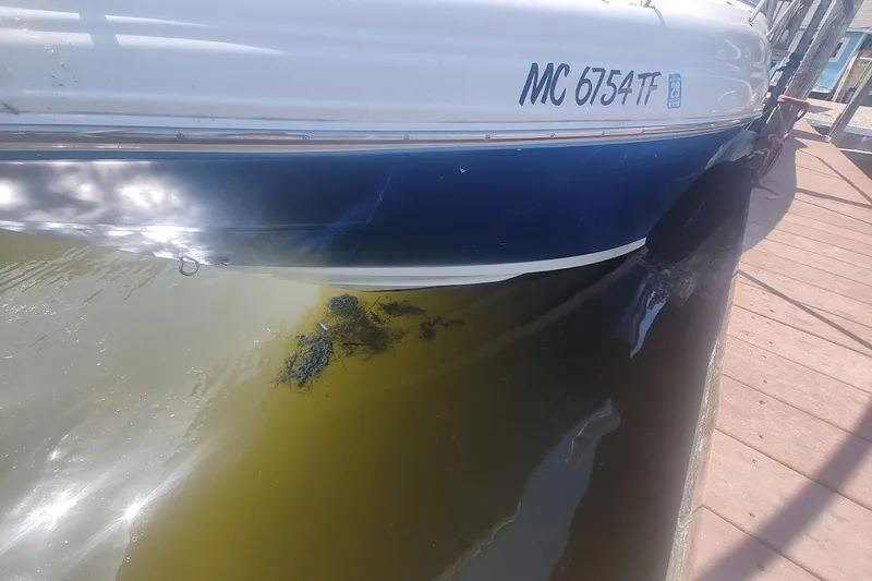 Slide: The Image of 2008 Sea Ray Sundancer 280 docked, showing hull and registration number MC 6754 TF. - 23