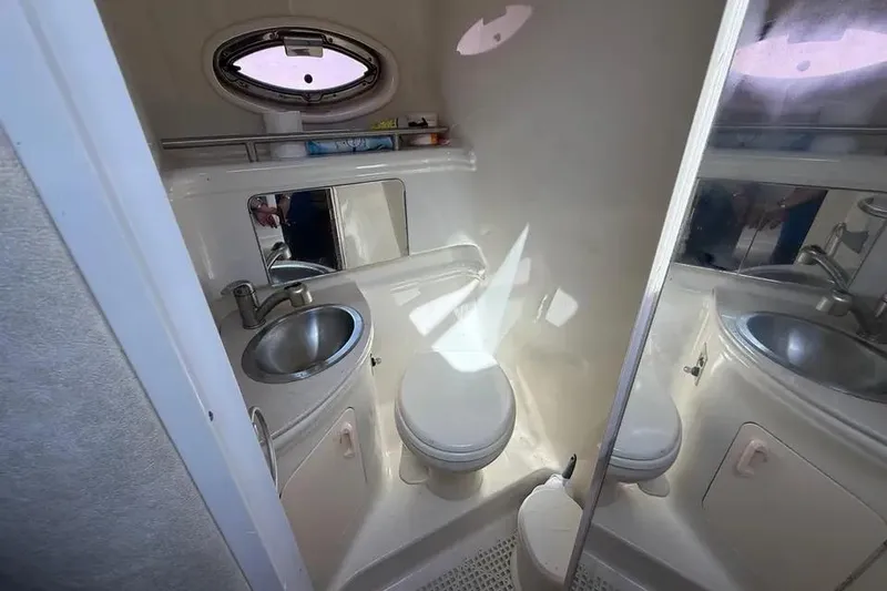Slide: The Image of Compact bathroom in 2008 Sea Ray Sundancer 280 yacht with sink, toilet, and mirror. - 22