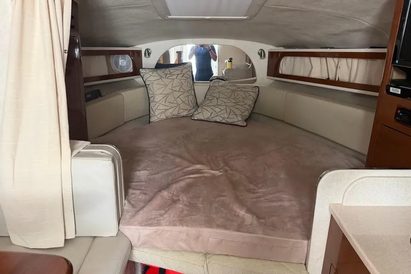 Slide: The Image of Interior cabin of 2008 Sea Ray Sundancer 280 with cozy bed and cushions. - 17