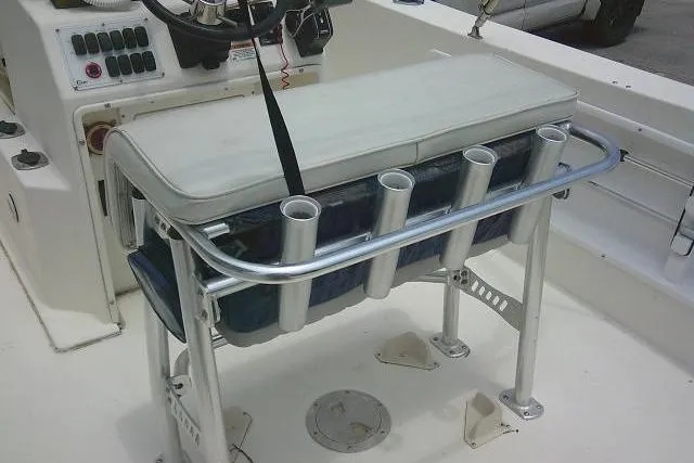 Slide: The Image of 2008 C-Dory 22' Angler boat interior with rod holders and cushioned seating. - 18
