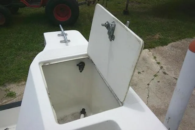 Slide: The Image of Open storage compartment on a 2008 C-Dory 22' Angler boat, showing interior details. - 27
