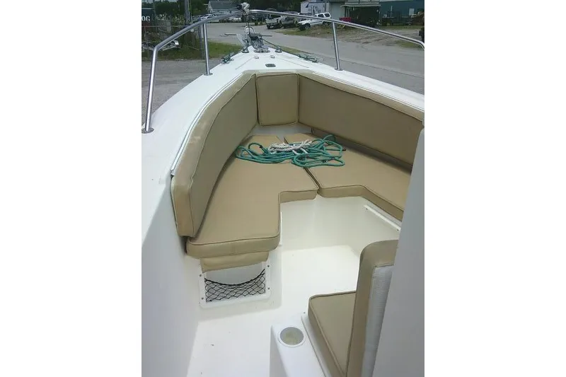 Slide: The Image of 2008 C-Dory 22' Angler boat interior with beige seating and coiled rope. - 8
