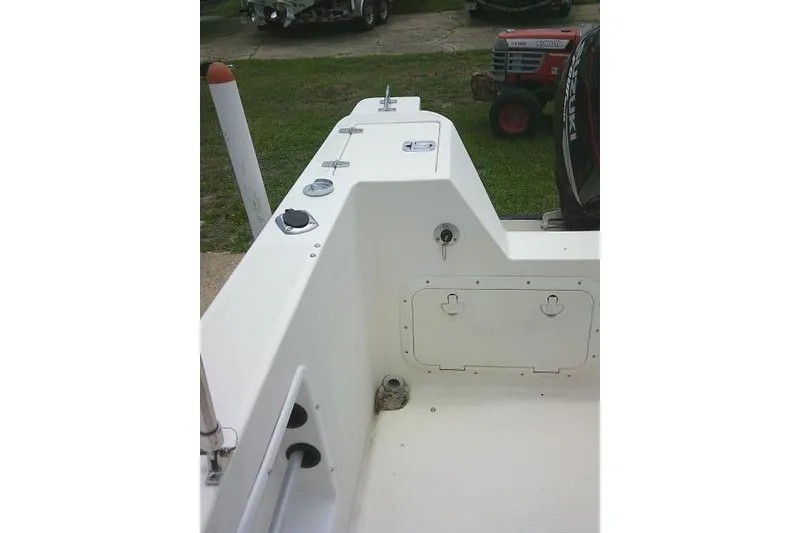 Slide: The Image of 2008 C-Dory 22' Angler boat interior, showcasing deck and storage compartments. - 15