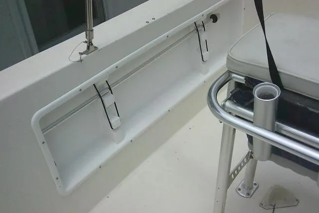 Slide: The Image of 2008 C-Dory 22' Angler boat interior, featuring seating and storage compartments. - 30