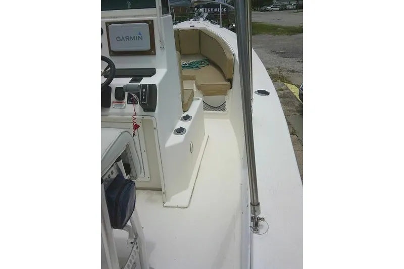 Slide: The Image of 2008 C-Dory 22' Angler boat interior with Garmin navigation system and seating area. - 20