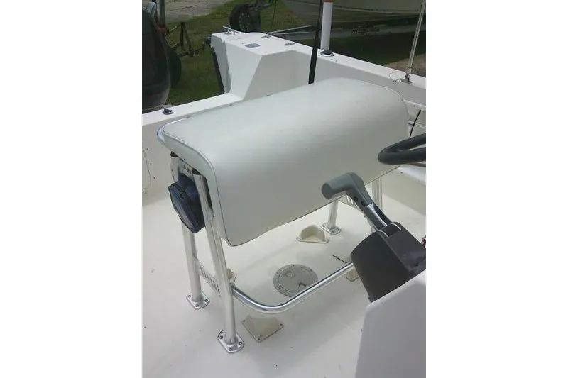 Slide: The Image of 2008 C-Dory 22' Angler boat interior with steering wheel and cushioned seat. - 14