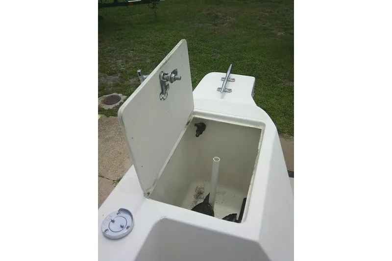 Slide: The Image of Open storage compartment on a 2008 C-Dory 22' Angler boat, showing interior details. - 28