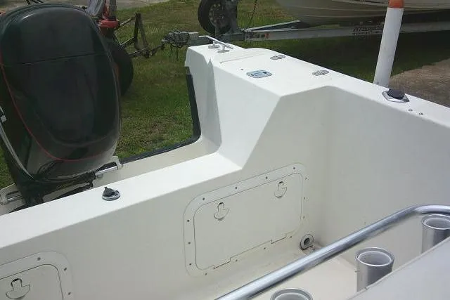 Slide: The Image of 2008 C-Dory 22' Angler boat interior with motor and storage compartments. - 16