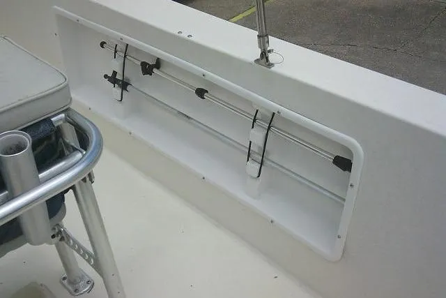 Slide: The Image of 2008 C-Dory 22' Angler boat interior with rod holders and seating. - 29