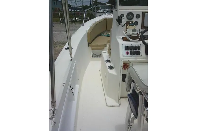 Slide: The Image of 2008 C-Dory 22' Angler boat interior with steering console and seating area. - 19