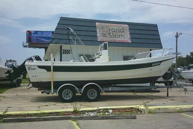 Slide: The Image of 2008 C-Dory 22' Angler boat on trailer outside Grand Slam building. - 1