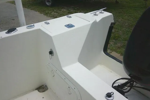 Slide: The Image of 2008 C-Dory 22' Angler boat interior with seating and storage compartments. - 25