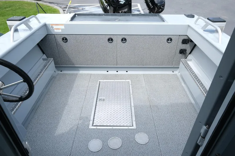Slide: The Image of 2022 Hewescraft 210 Sea Runner ET Hardtop boat interior with storage compartments. - 13