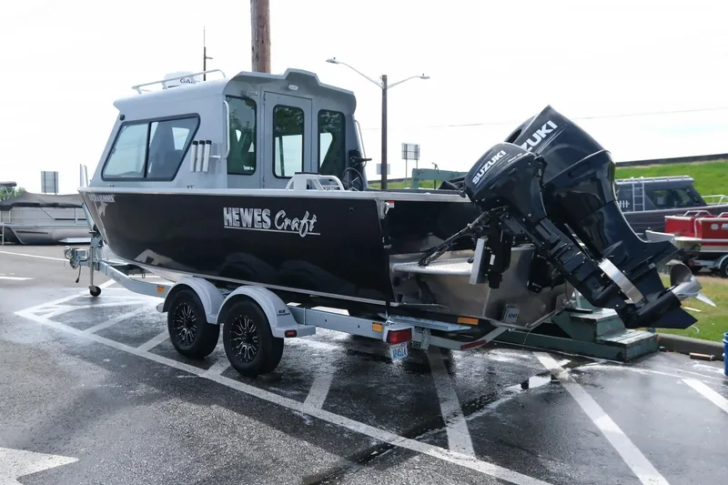 Slide: The Image of 2022 Hewescraft 210 Sea Runner ET Hardtop boat on trailer with Suzuki outboard motor. - 10